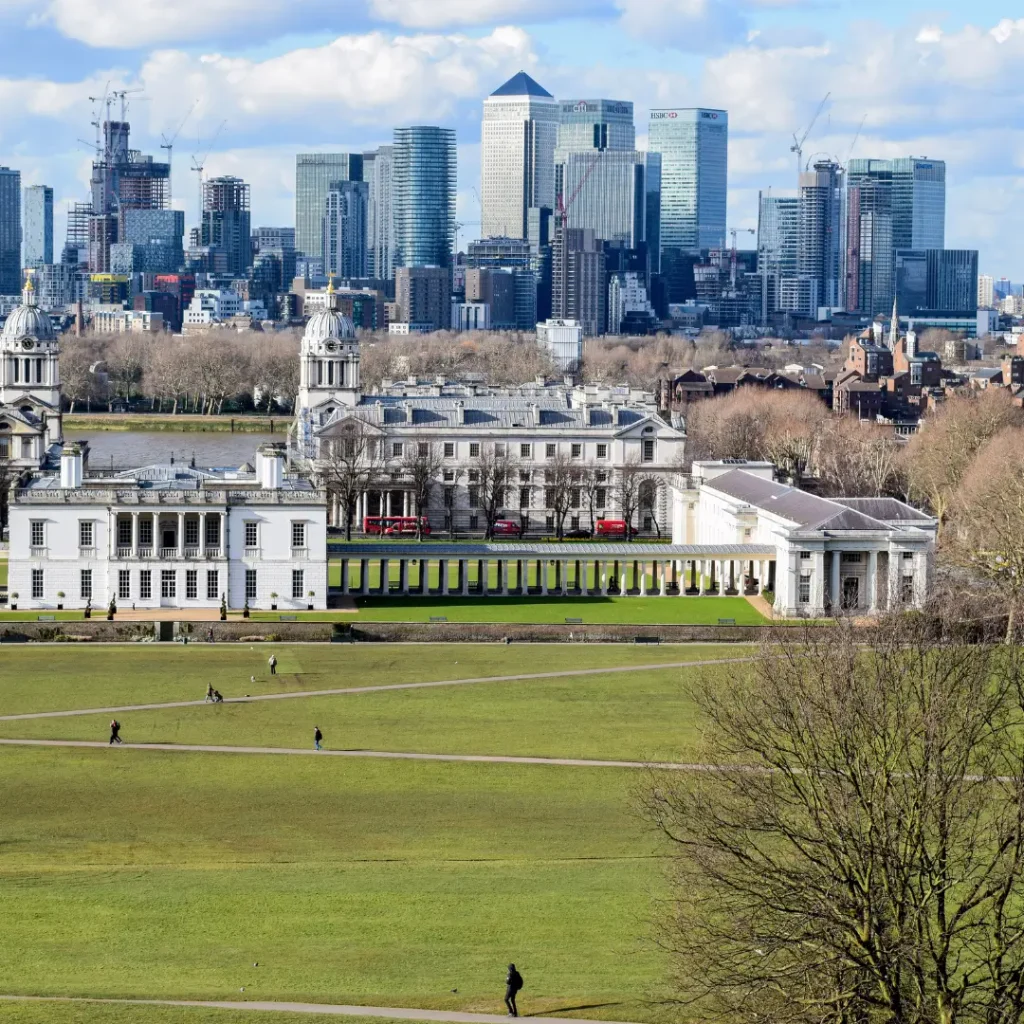 Stunning aerial view of Greenwich Park with London skyline in the background.
